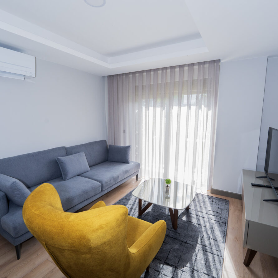 Spacious living room of Deluxe Garden View Suite in Antalya Kundu