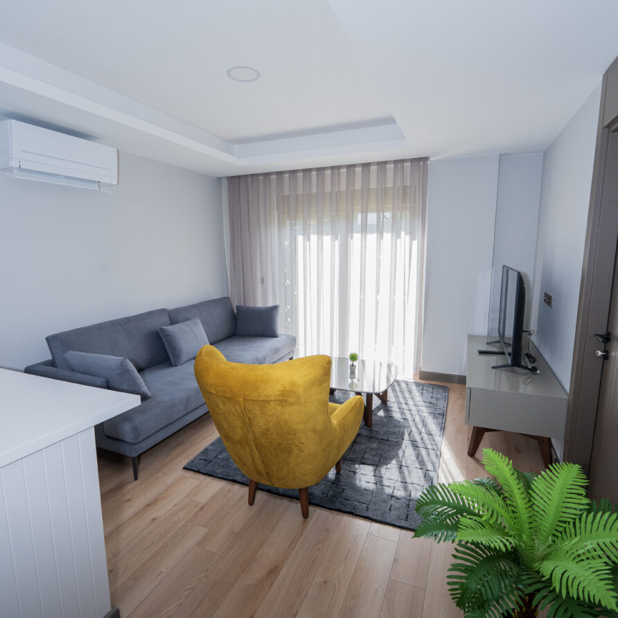 Spacious living room of Deluxe Garden View Suite in Antalya Kundu