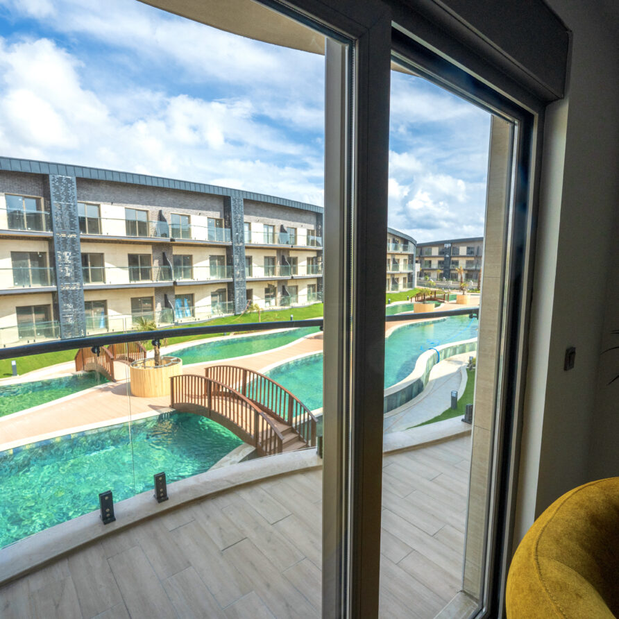 Private balcony with pool view at Holicas Luxury Pool View Suite