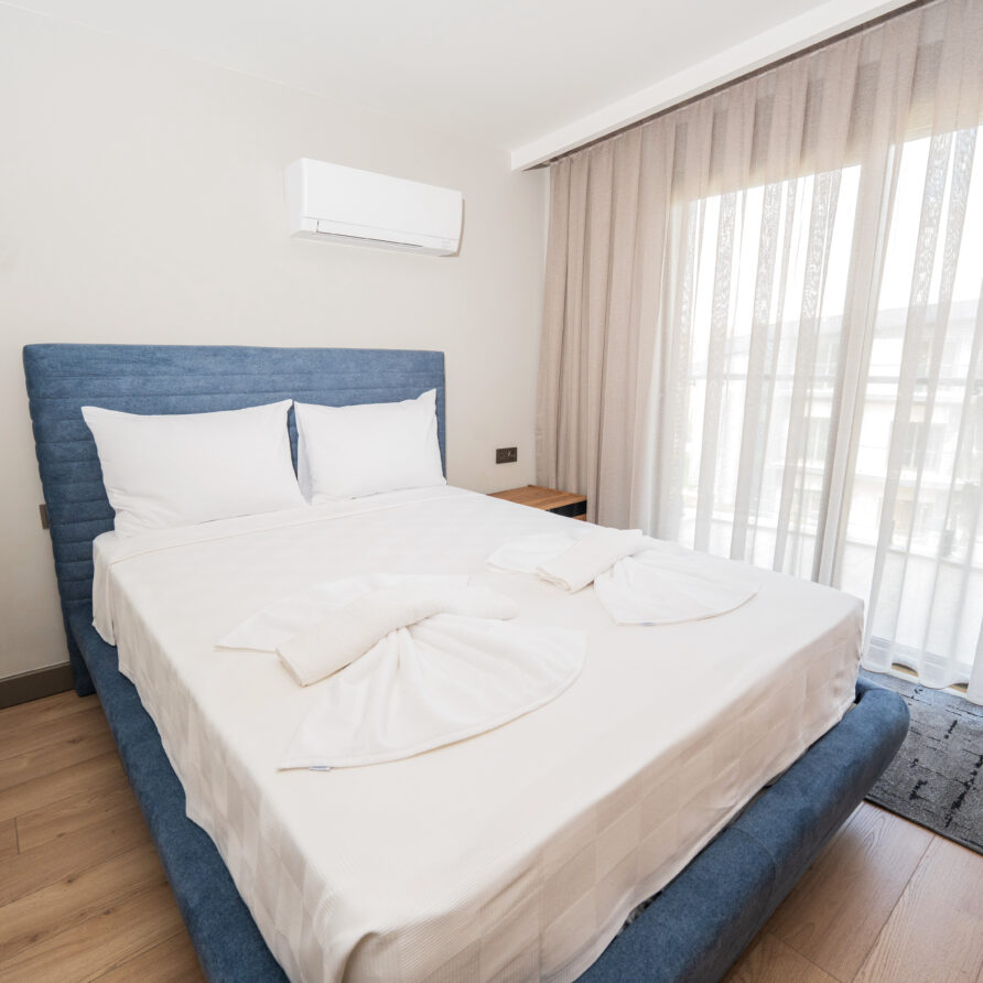 Spacious bedroom in Antalya luxury suite with pool view