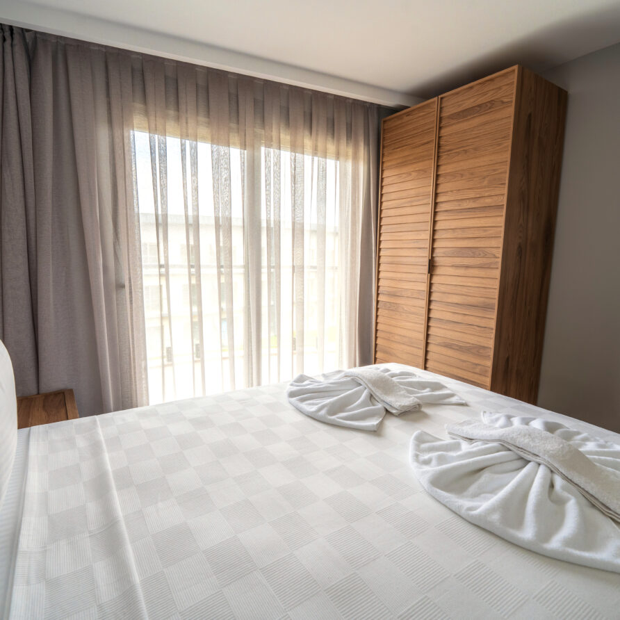 Spacious bedroom in Antalya luxury suite with pool view
