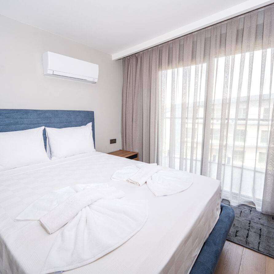 Spacious bedroom in Antalya luxury suite with pool view