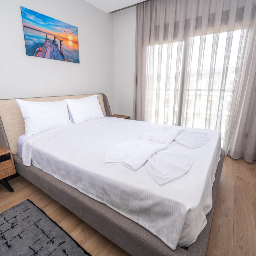 Spacious bedroom in Antalya luxury suite with pool view