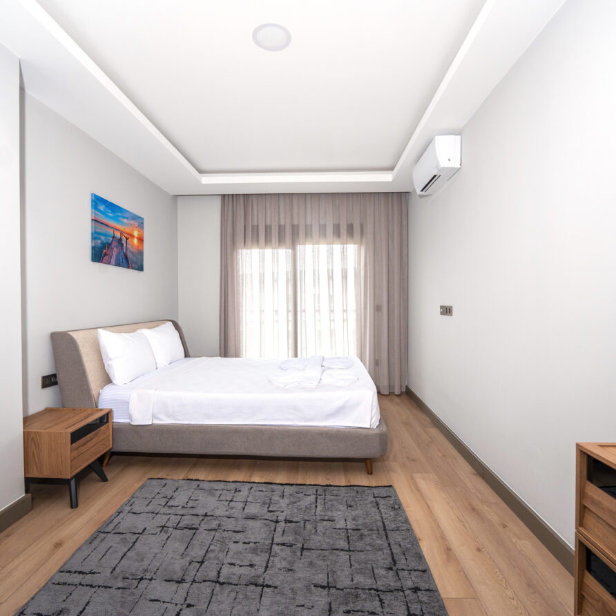 Spacious bedroom in Antalya luxury suite with pool view