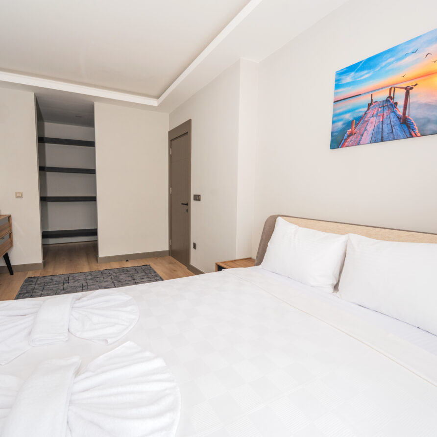 Spacious bedroom in Antalya luxury suite with pool view