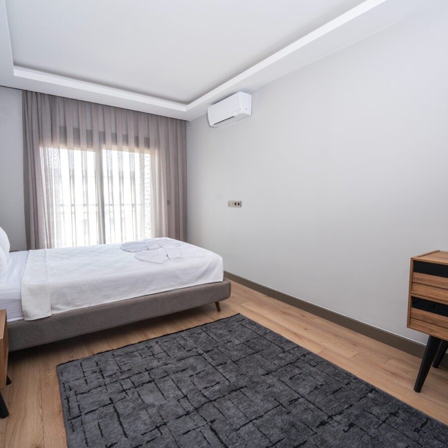 Spacious bedroom in Antalya luxury suite with pool view